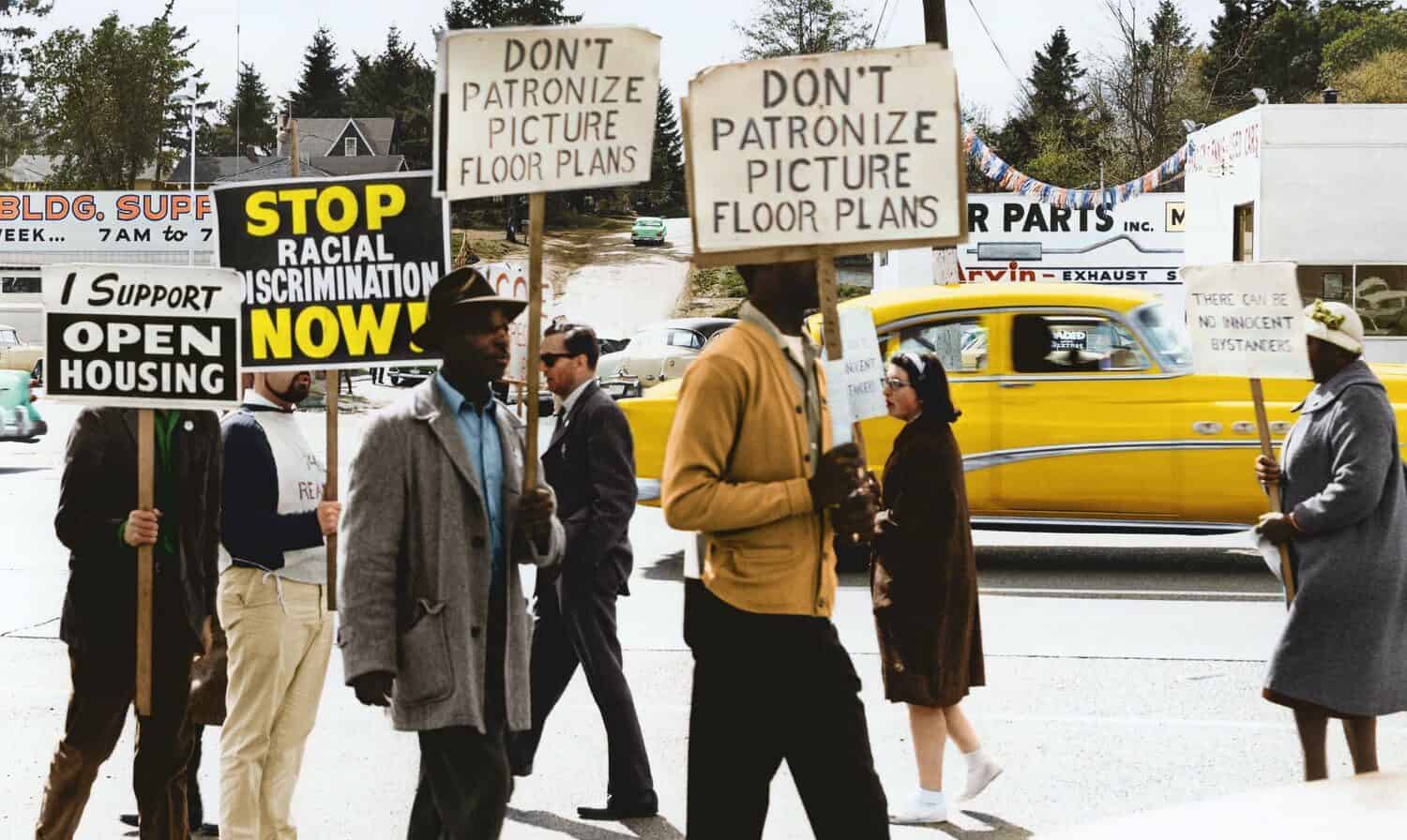 black segregation Protestors holding anti-racism signs