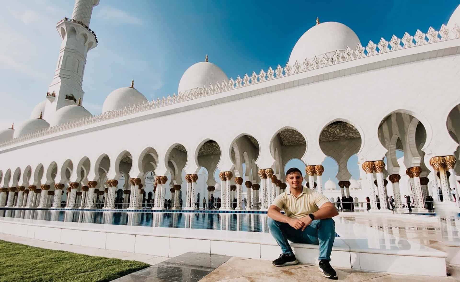 man visiting the Grand Mosque in Abu Dhabi