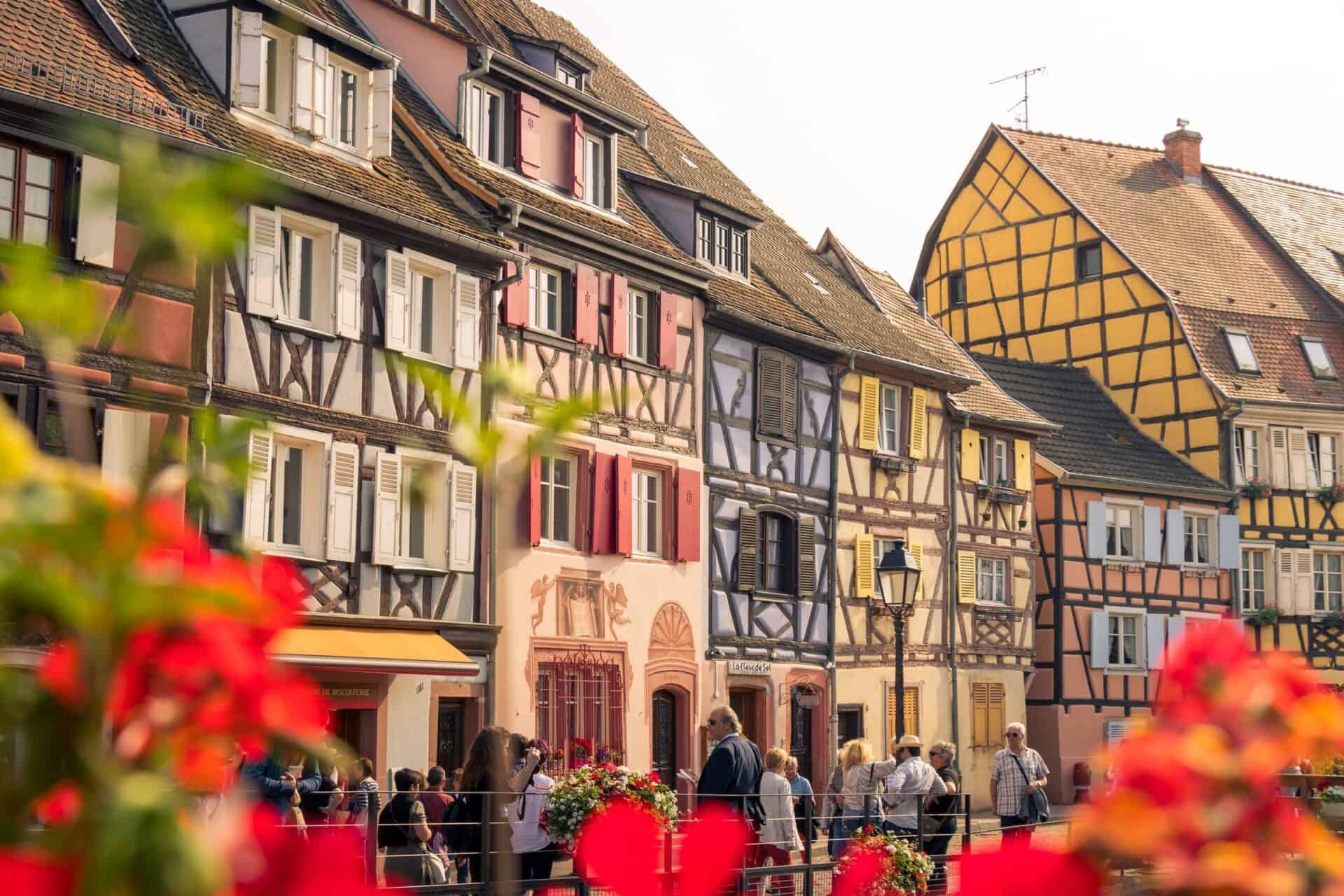 row of adorable French homes with flower beds in Colmar