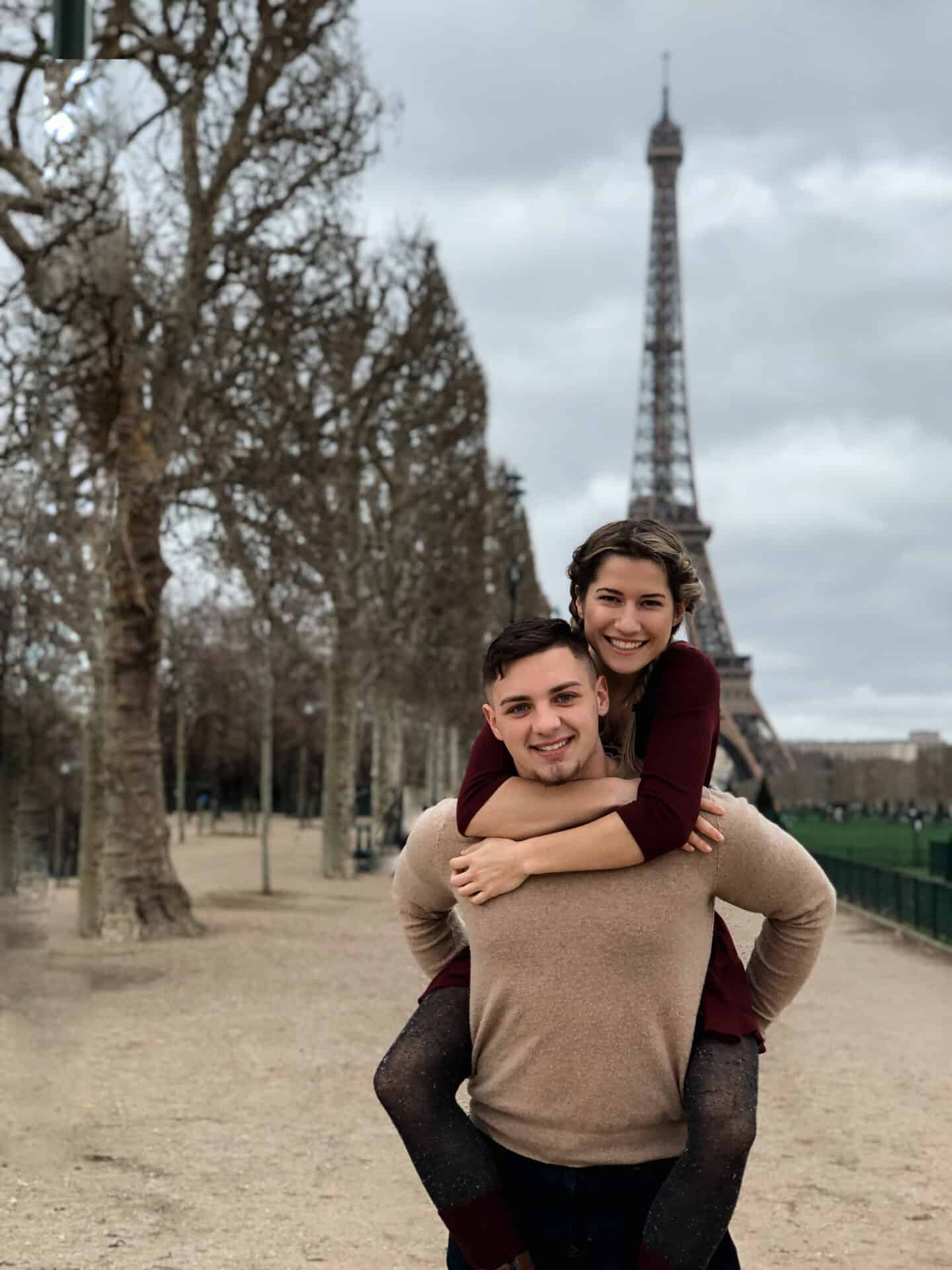 Man Carrying woman at the eiffel tower