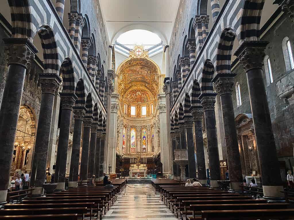 Interior of San Lorenzo church in Genoa with black and white striped pillars