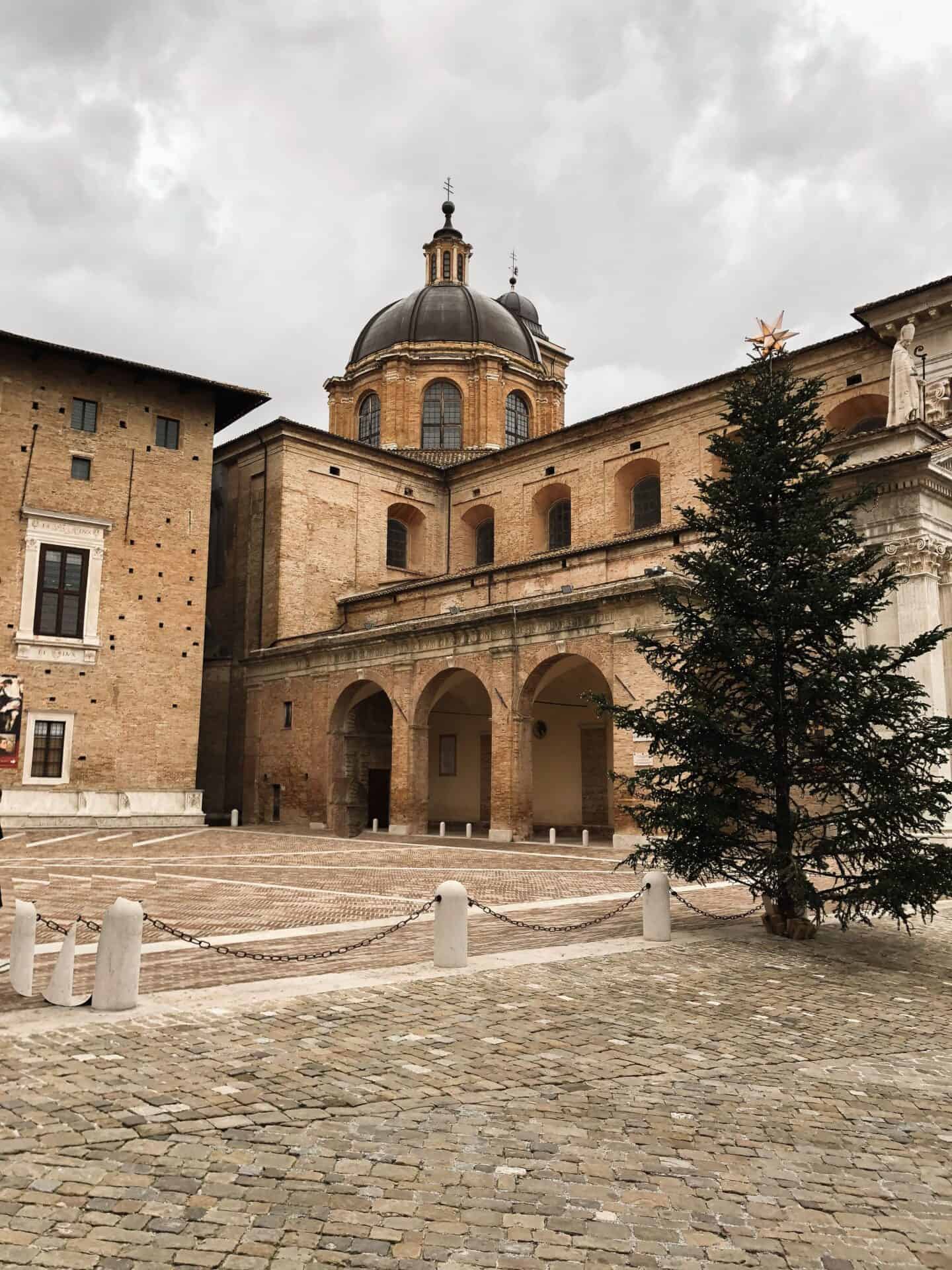 main square in urbino italy on an overcast day