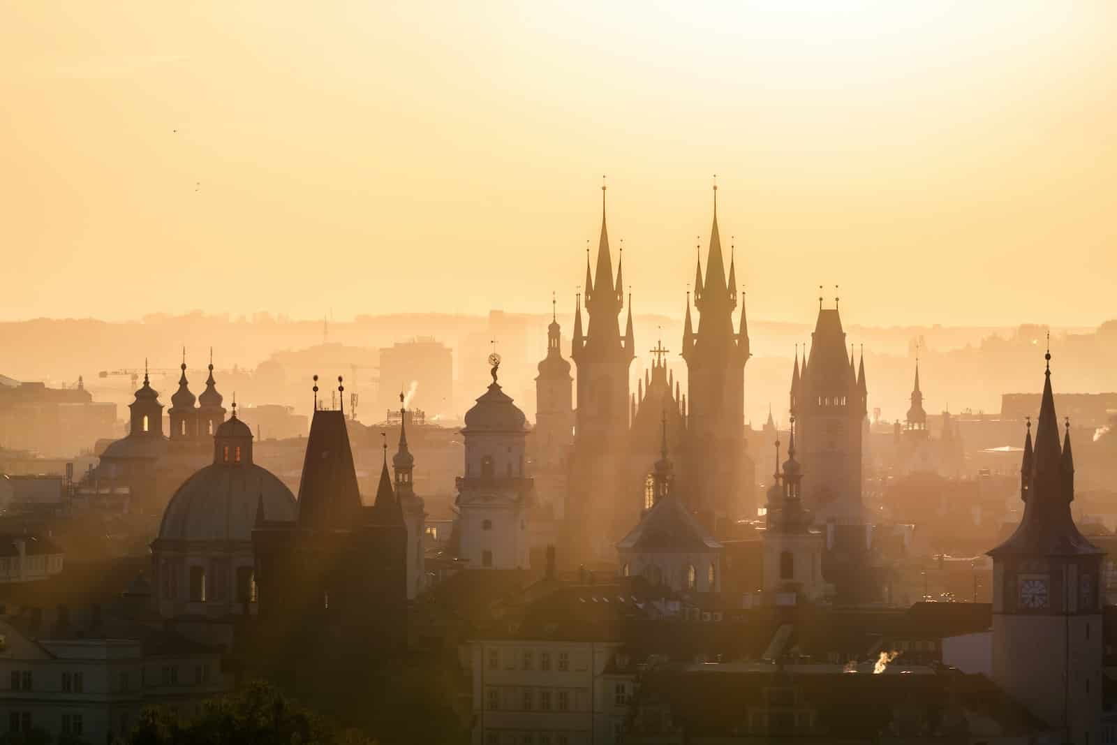 Prague city sckyline during misty dusk and warm lighting