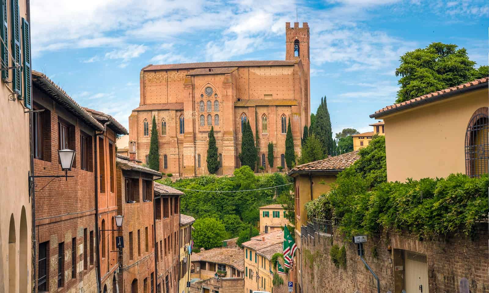 landscape photography of siena with san domenico church on the hill