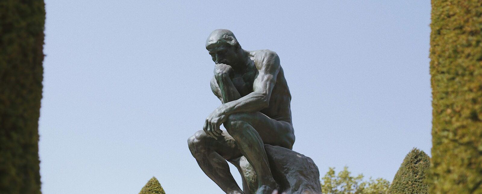 man sitting statue called the thinker