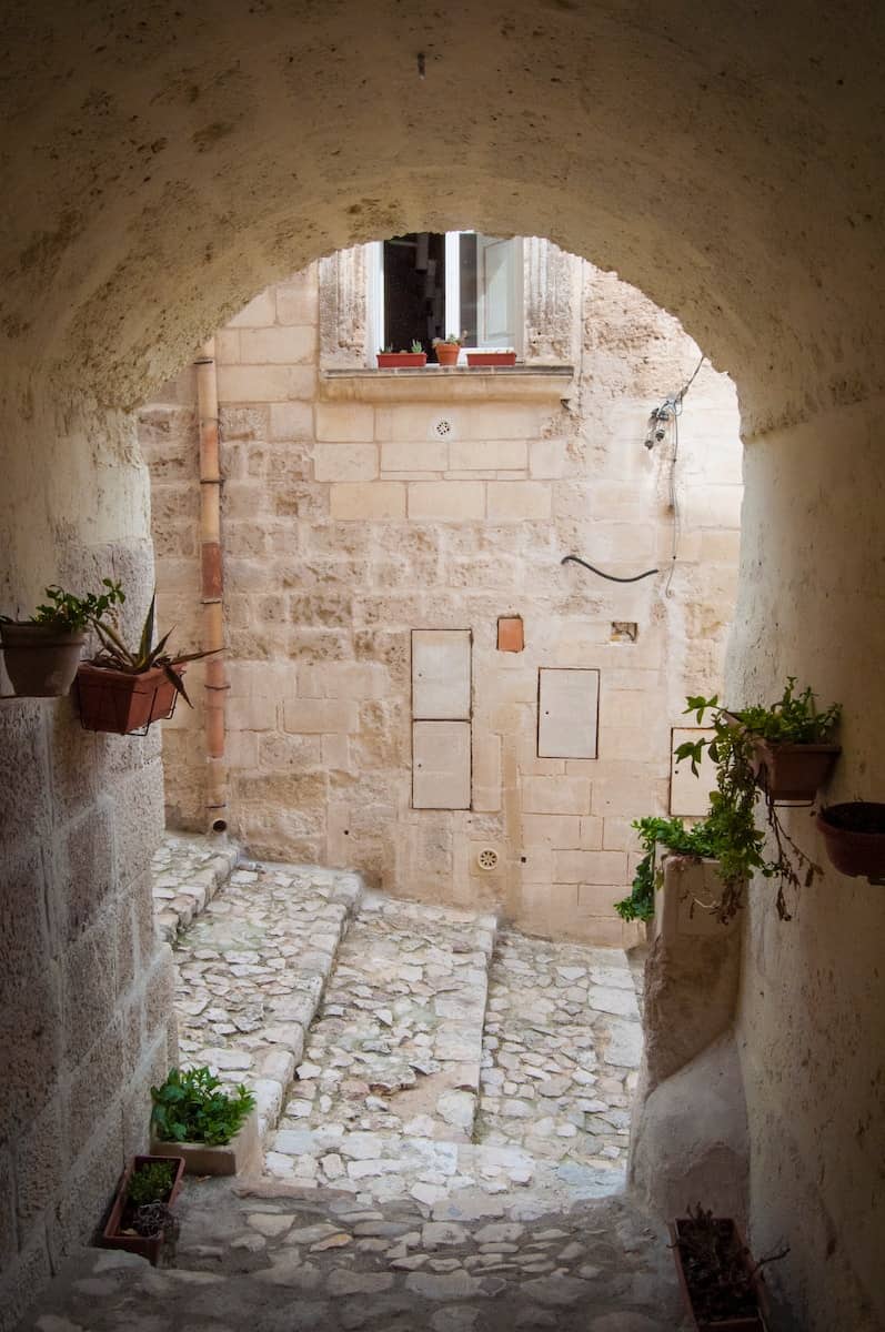 white stone archway in Matera Italy