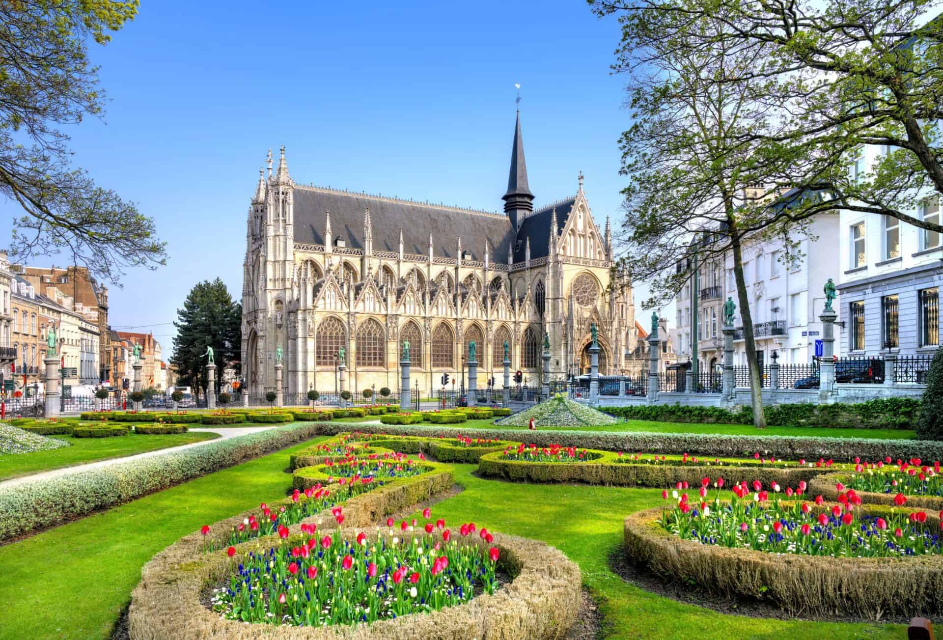 Garden surrounding stone cathedral in brussels