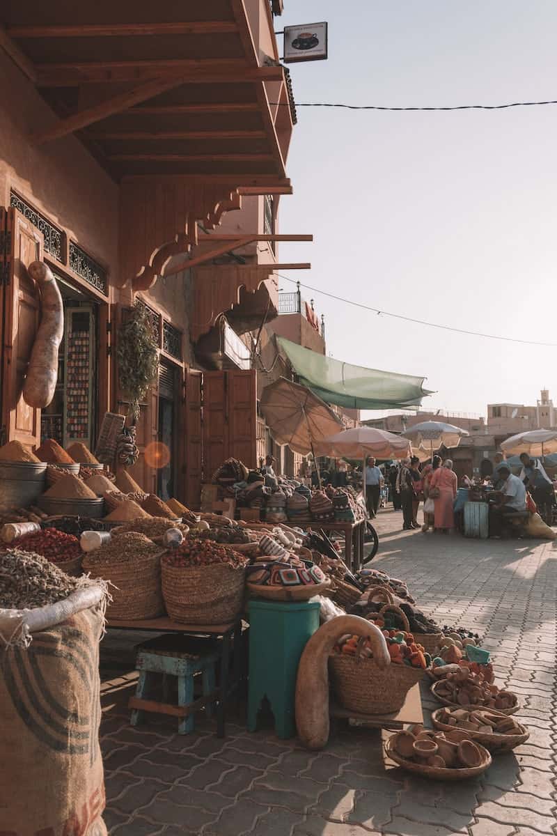 people in souk market selling goods during daytime in Marrakech