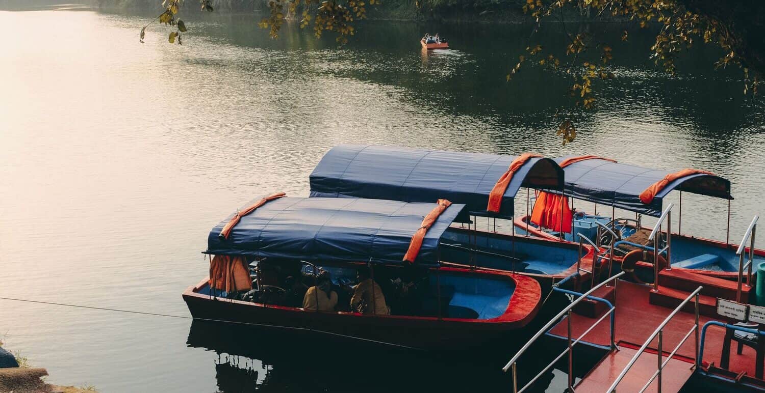 Covered passenger boats floating on Bhatiari