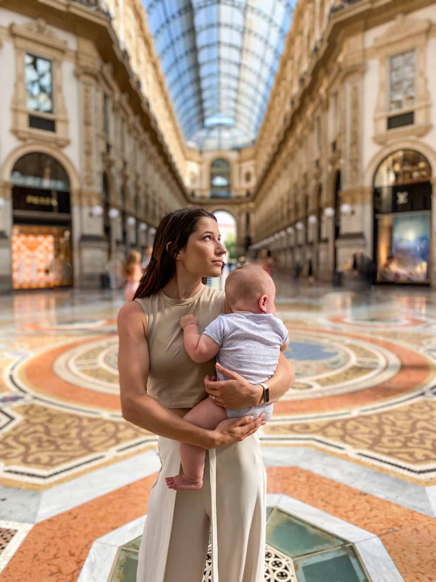 mother and 6 month old baby at Galleria early in the morning in milan
