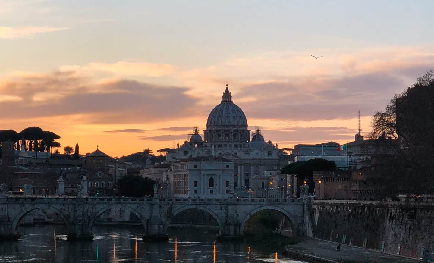 Sunset behind St. Peter's Basilica in Rome during autumn