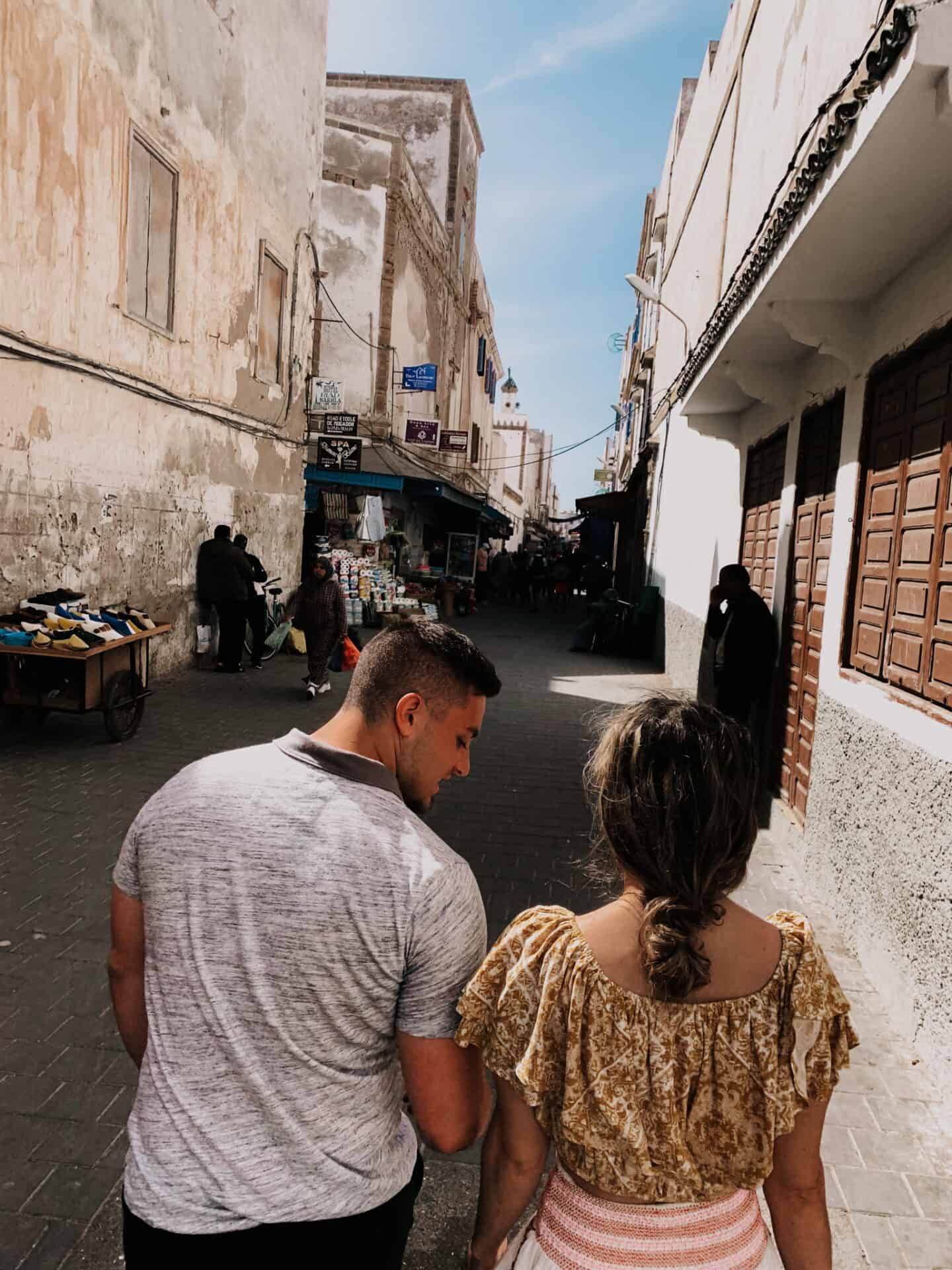 couple strolling the majestic streets of morocco