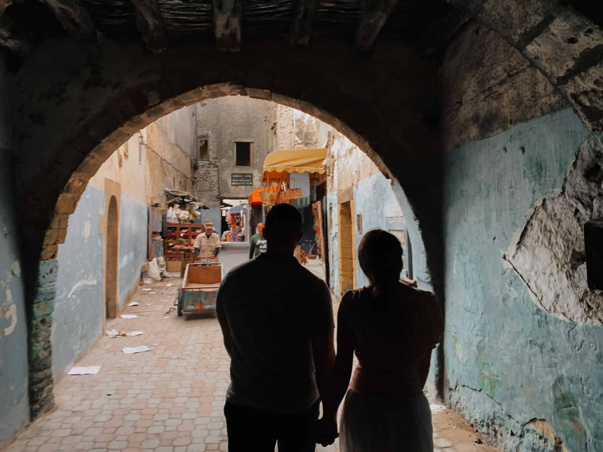 silhouette of couple strolling the majestic streets of morocco