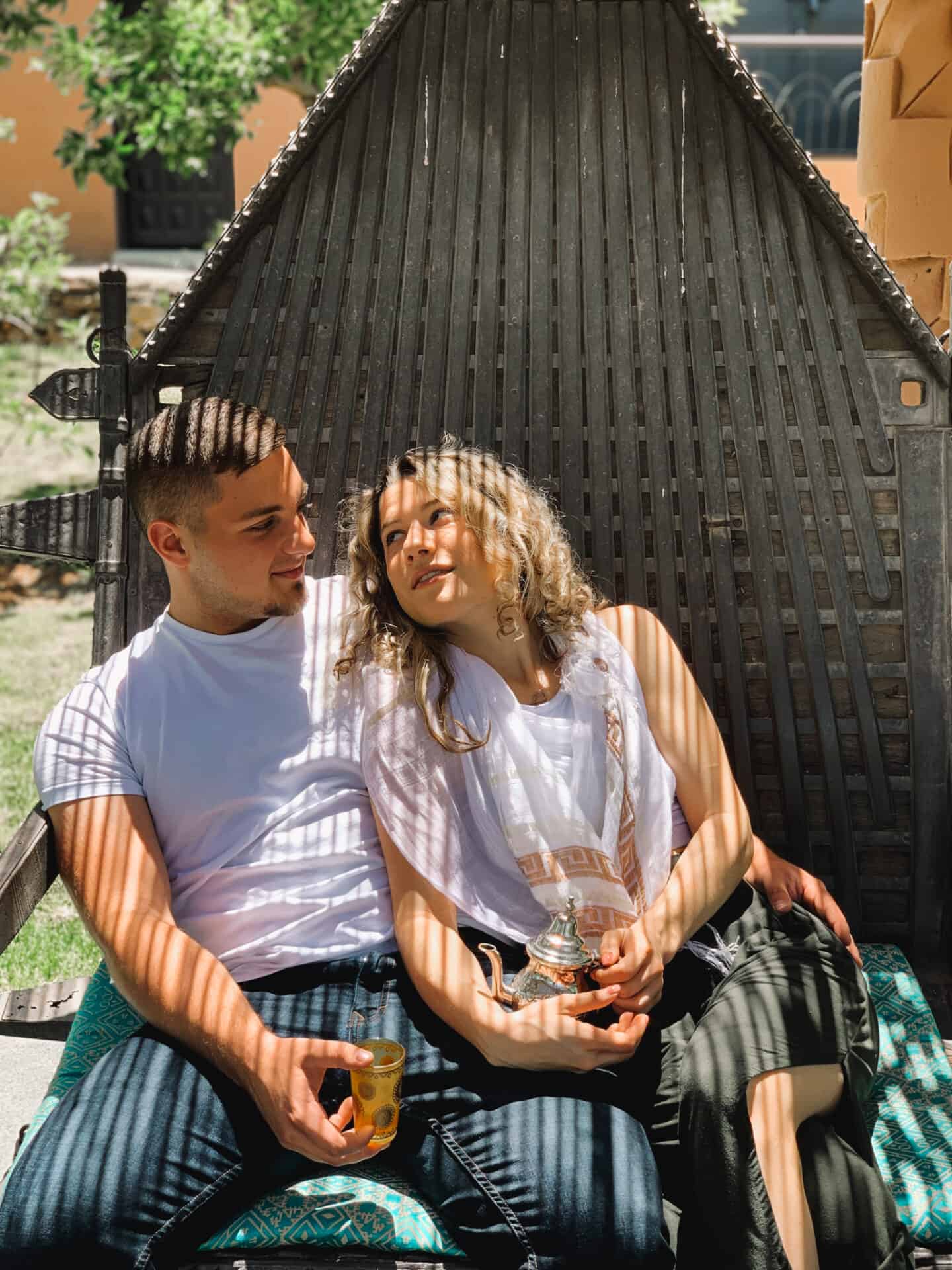 man and woman drinking moroccan mint tea in marrakech