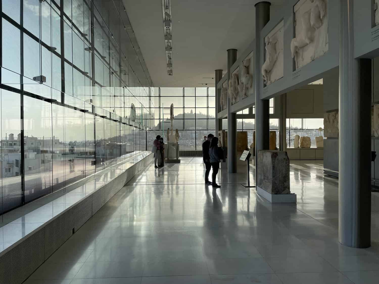 Woman standing at exhibit in the Acropolis Museum