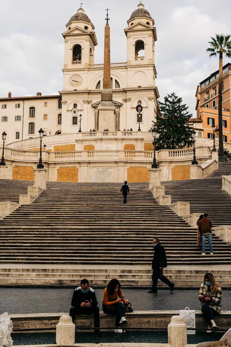 People walking up the spanish steps in rome during daytime