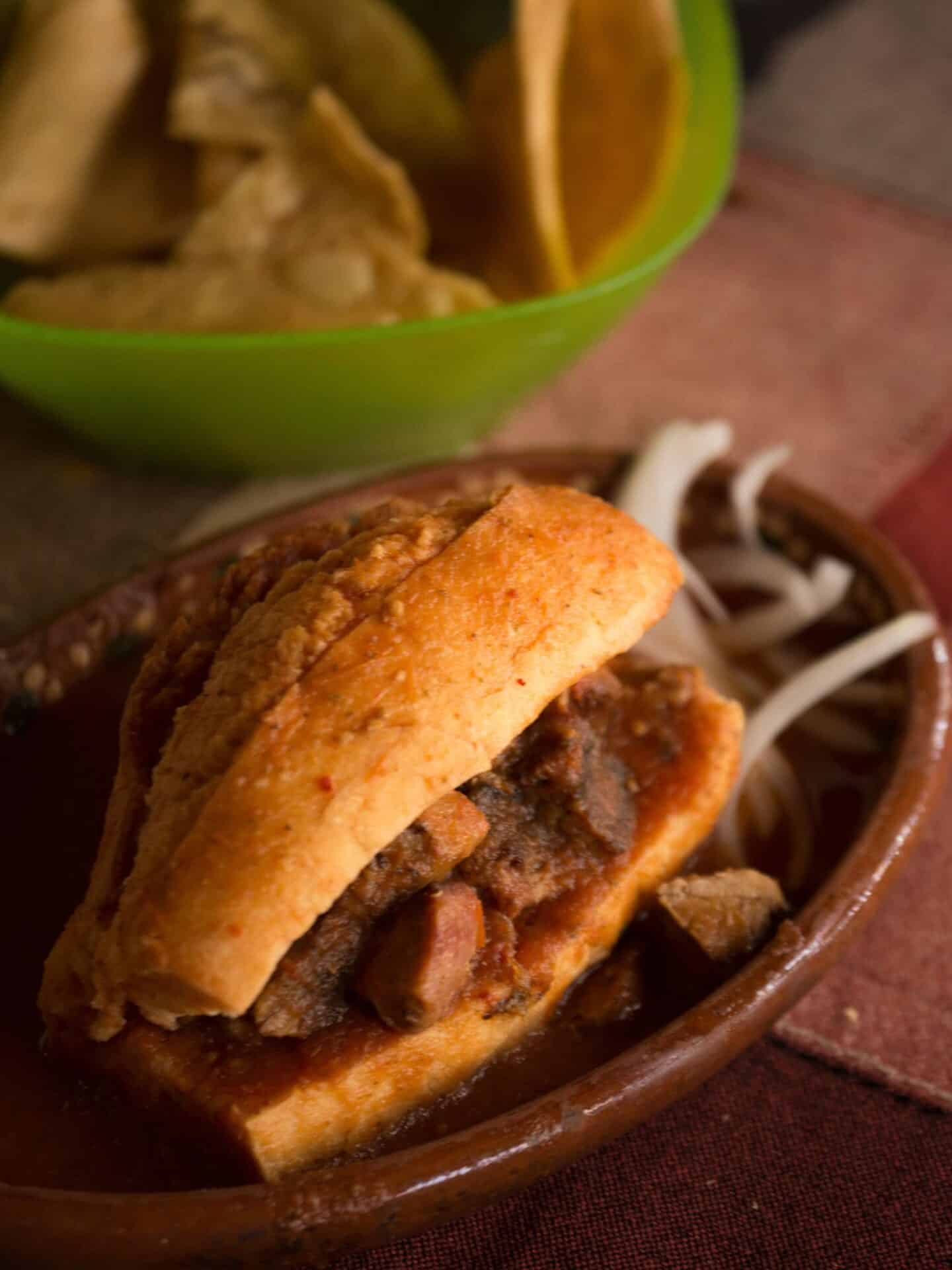 a mexican torta on a ceramic plate