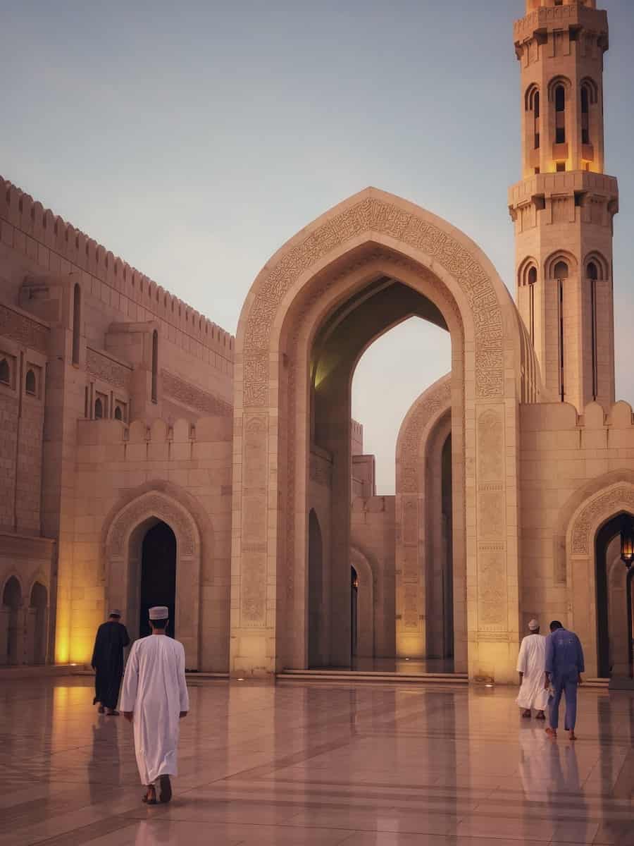 people walking at Grand Sultan mosque building in Muscat Oman