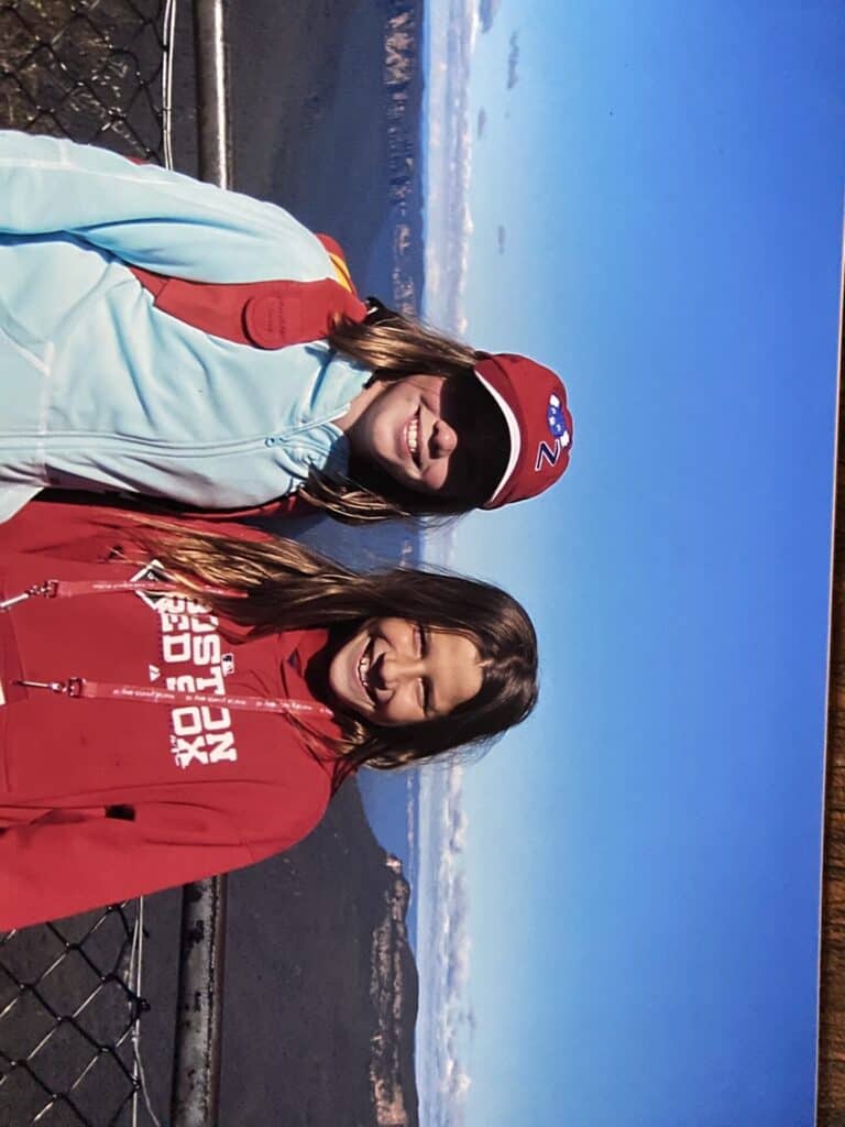 two young girls smiling in front of blue mountains lookout in australia