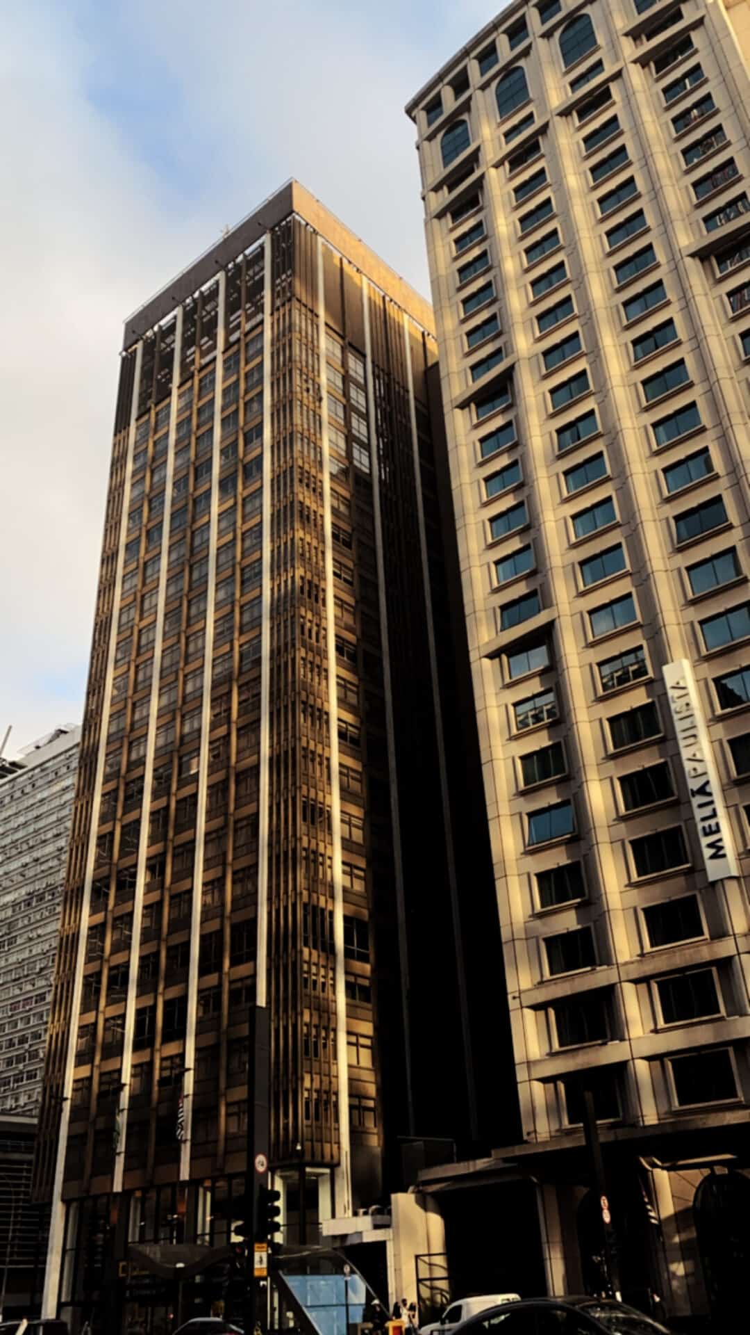 concrete skyscraper in sao paulo duing golden hour