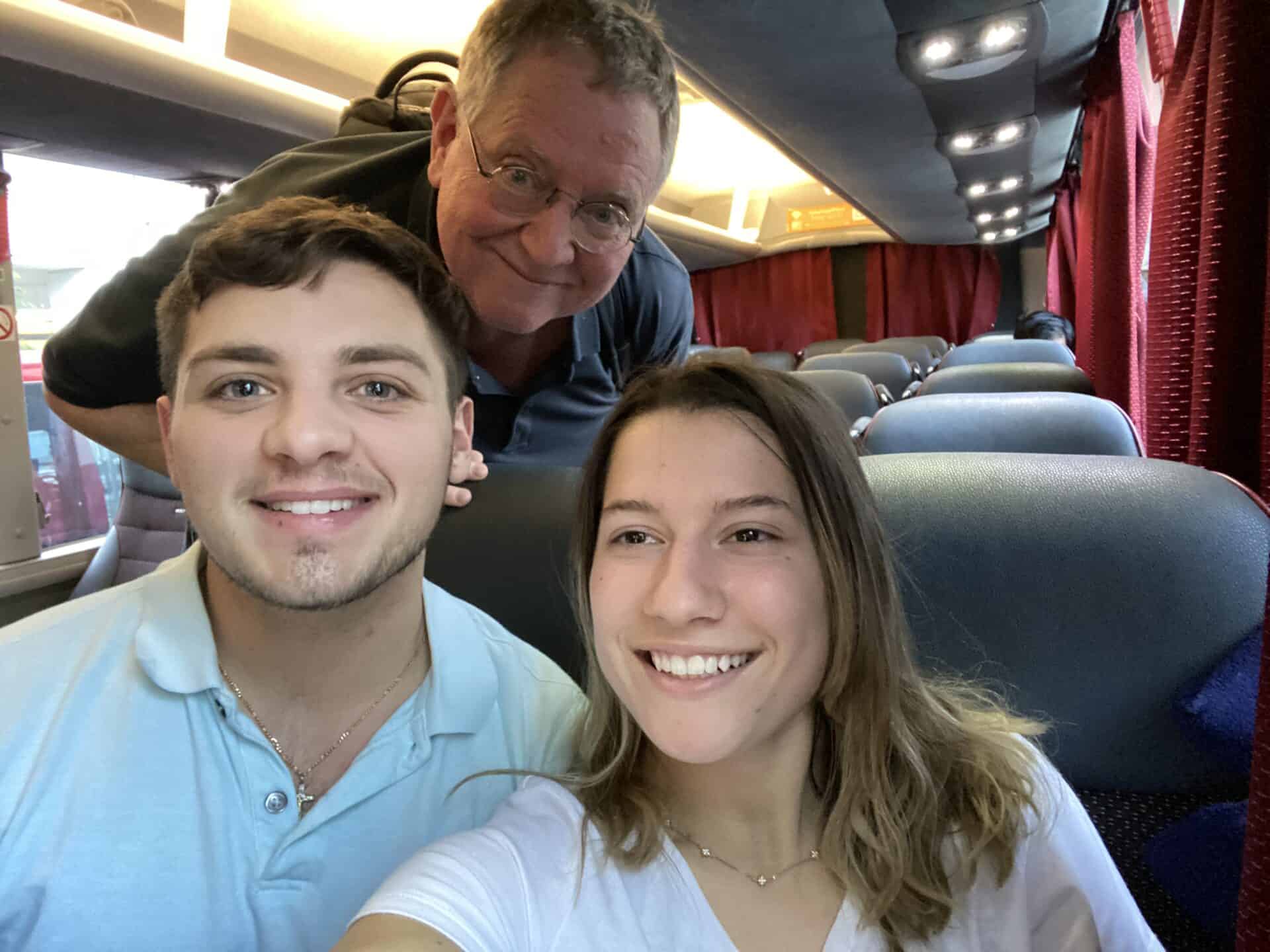 selfie of american couple and elderly british man on a bus