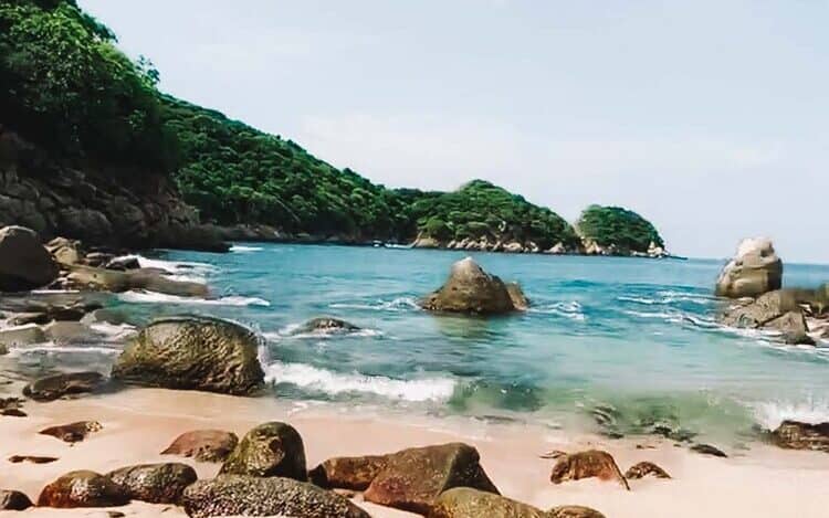 tranquil beach with clean sand and blue waters