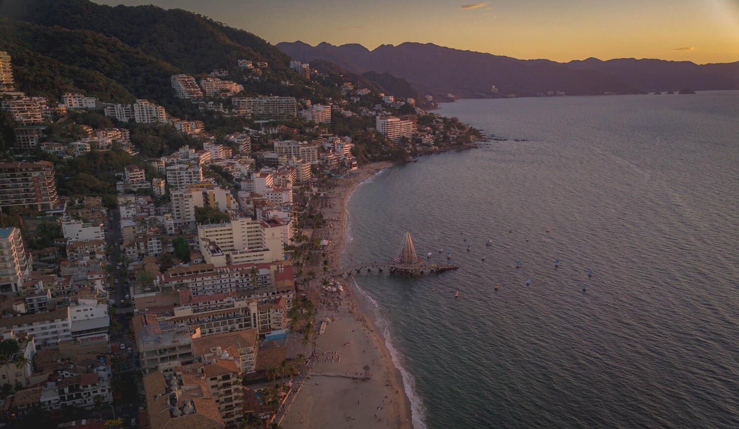 Drone shot of Los Muertos Beach in Puerto Vallarta at sunset