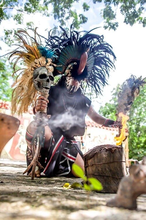 Mayan man with feather helmet in Cozumel, Mexico