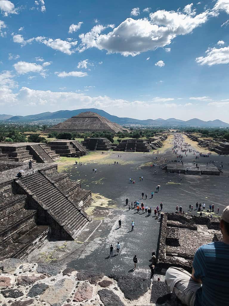 tourists climbing the Teotihuacan pyramids in Mexico