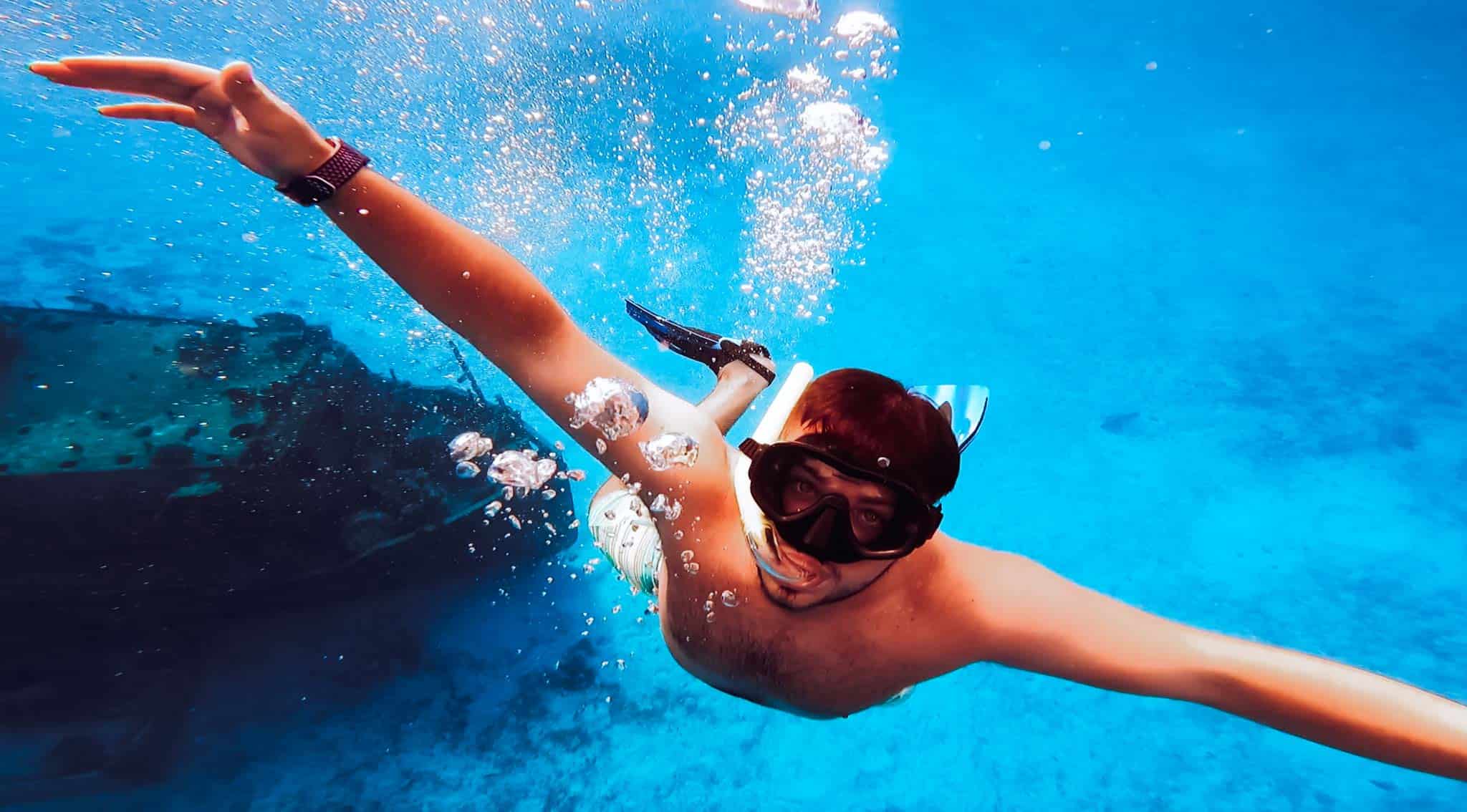 portrait of snorkeling man floating underwater