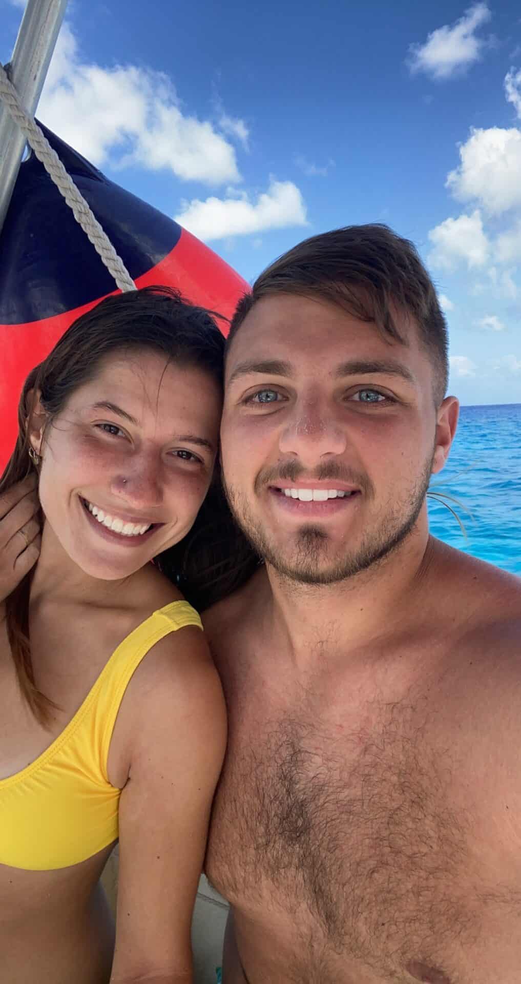 selfie of couple on a boat in the ocean
