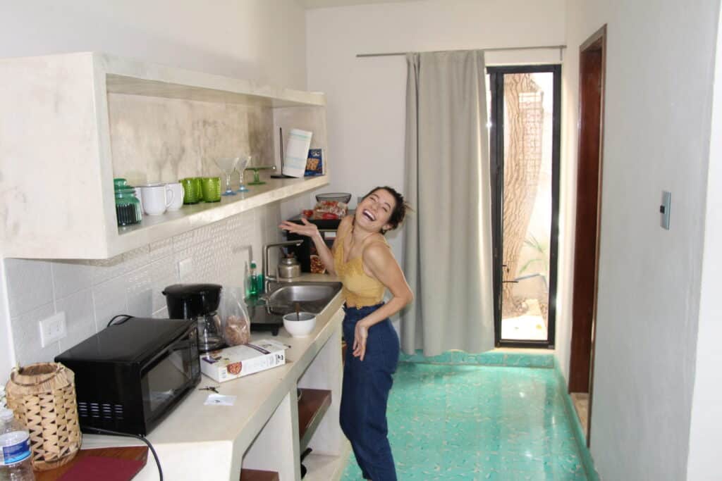woman standing in small kitchen