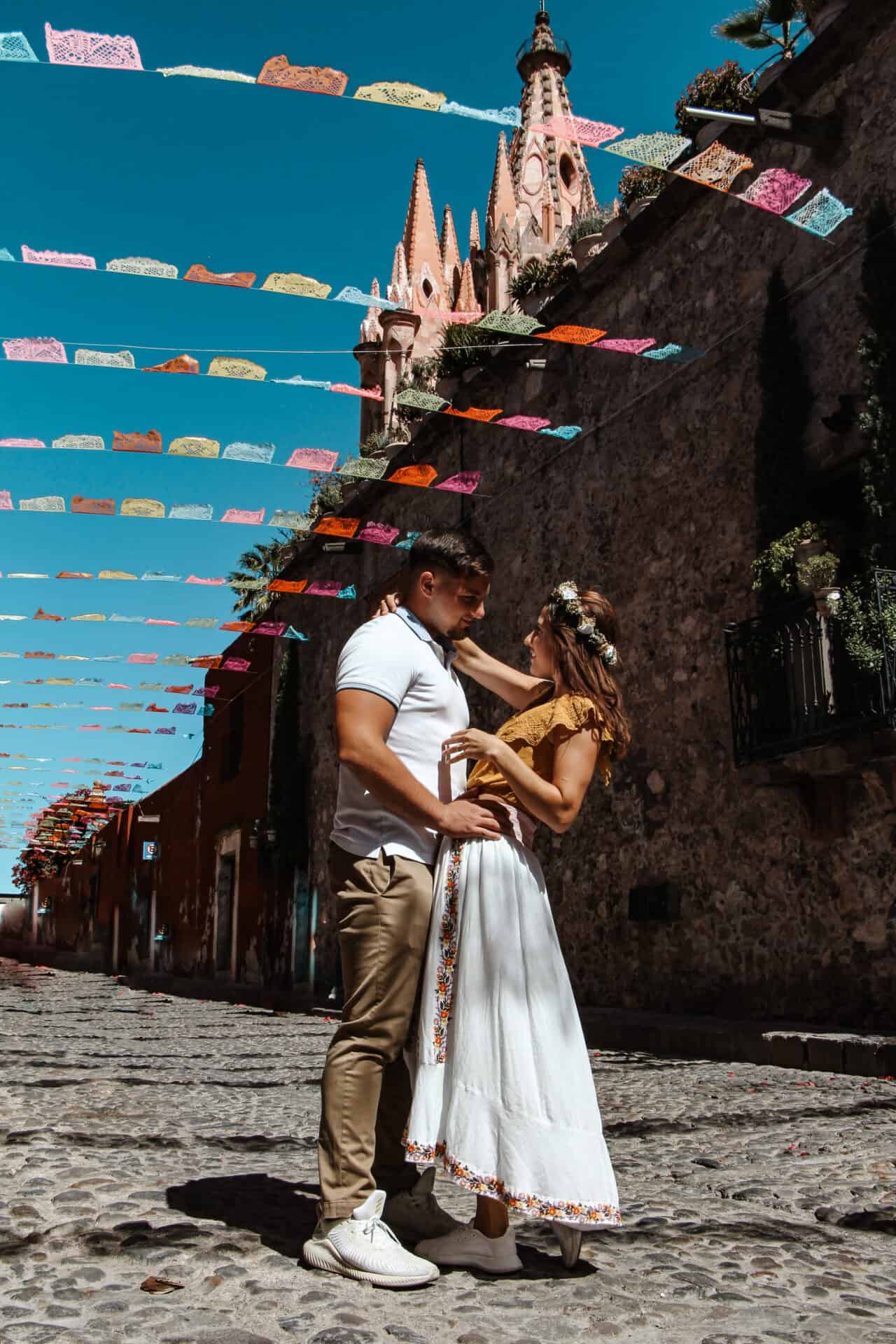 American couple dancing in San Miguel de Allende street during Day of the Dead