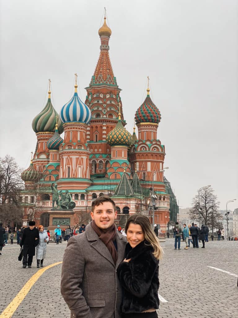 man and woman standing in front of main church in moscow