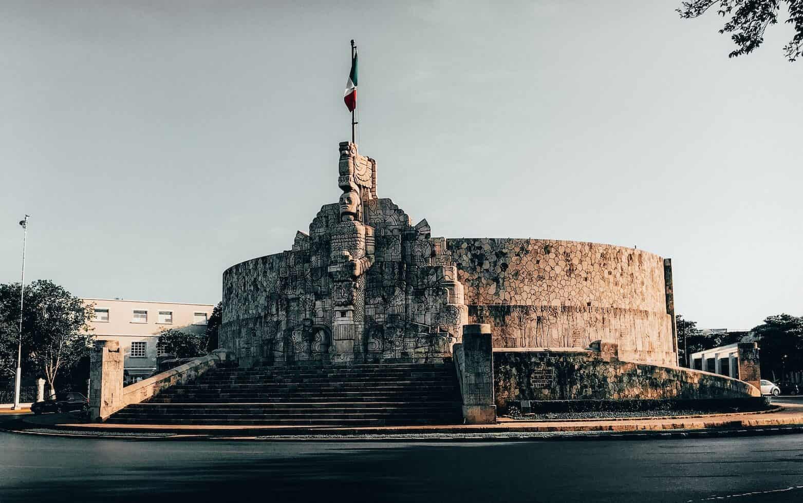 round white concrete mexican building with moody vibe