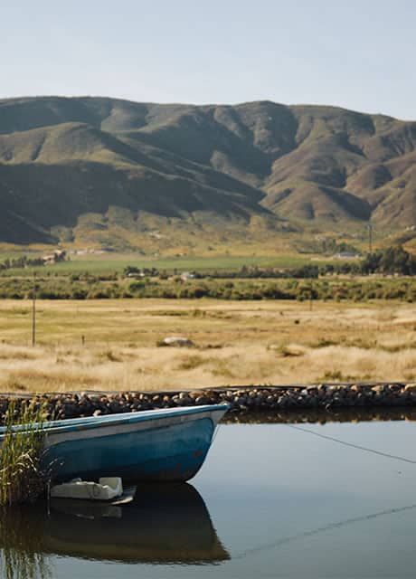 boat on lake overlooking mountains of mexico