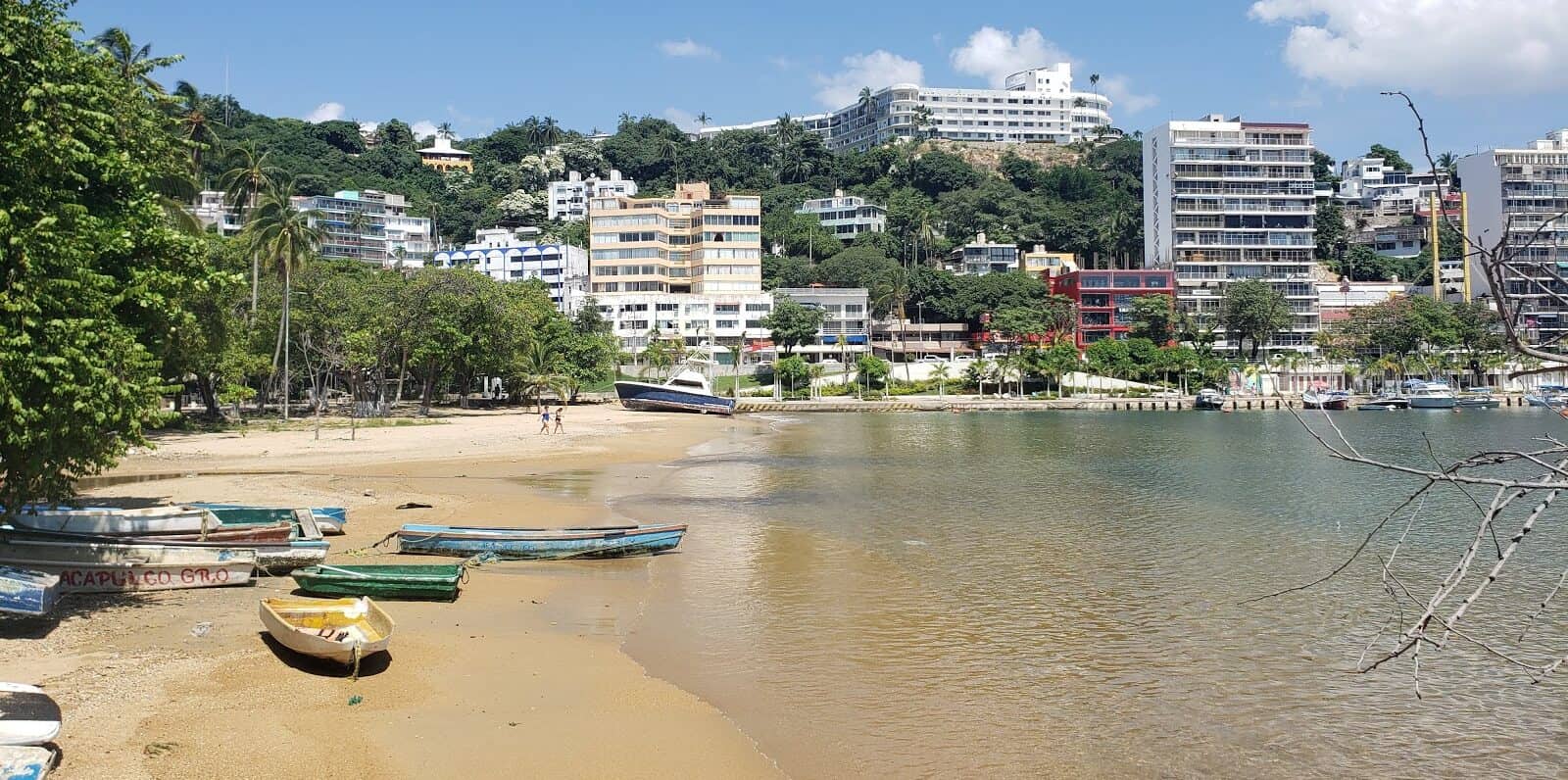 beach with small boats in mexico