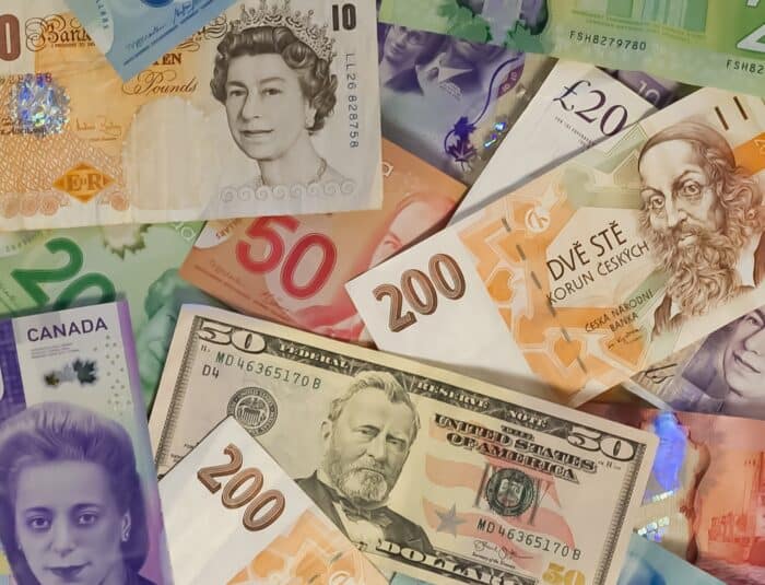 pile of international cash bills