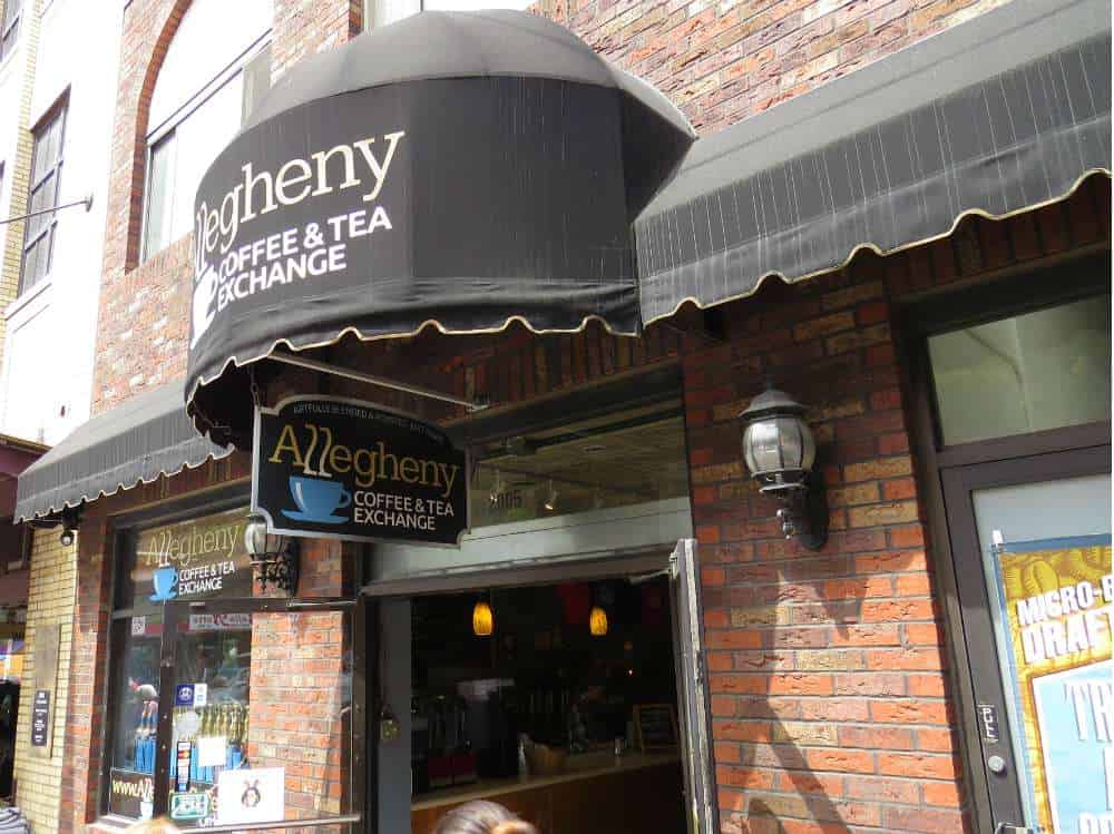 exterior of coffee house with black awning