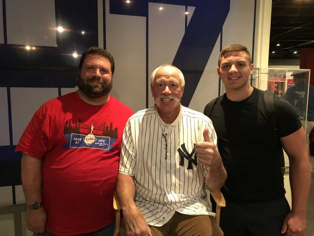 adult father and son meeting famous New York Yankees baseball player