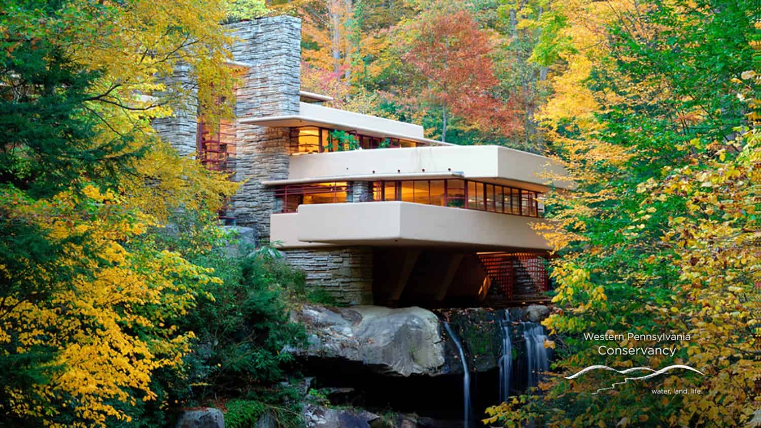 Fallingwater historic natural home surrounded by green and yellow trees outside of Pittsburgh