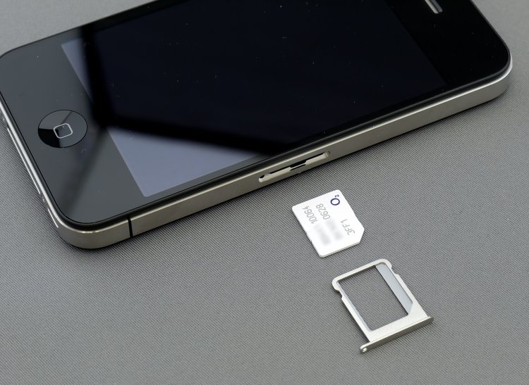 sim card and iphone on table