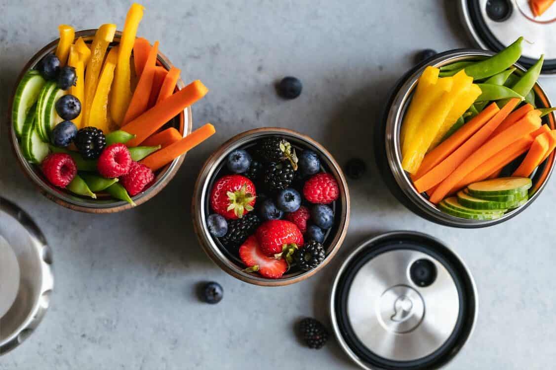 fruits and vegetables in metal cups