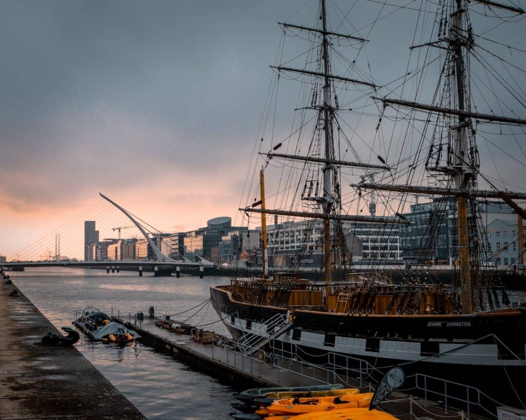 black and brown ship on dublin river during dusk