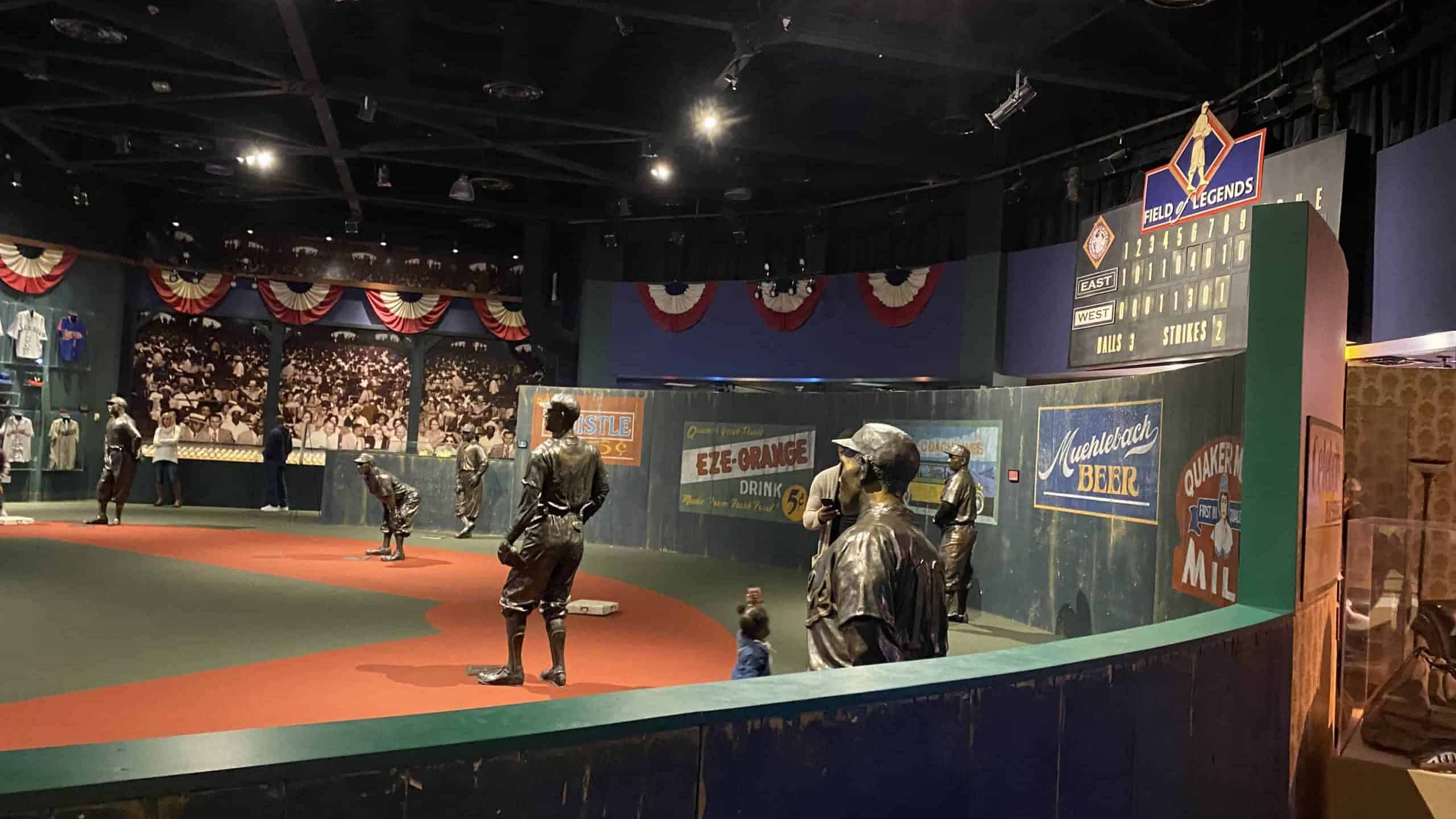 Indoor baseball field with statues at Negro Leagues Museum