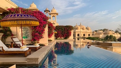 gorgeous hotel outdoor pool surrounded by Indian palace architecture