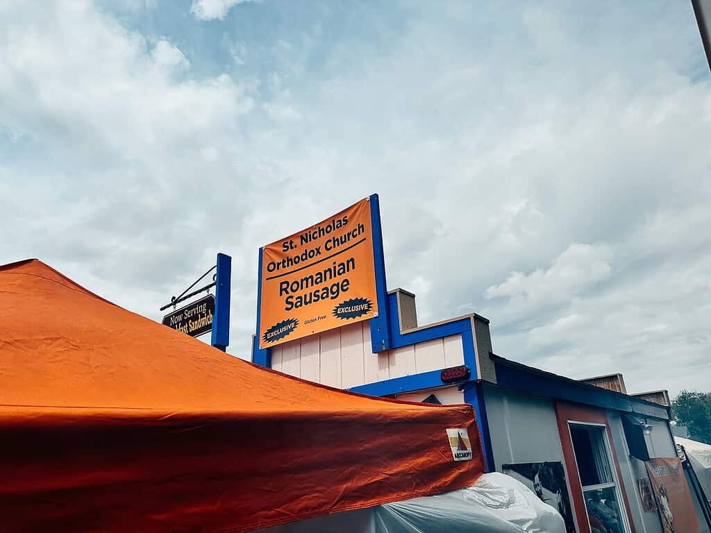 bright orange sign advertising romanian sausage
