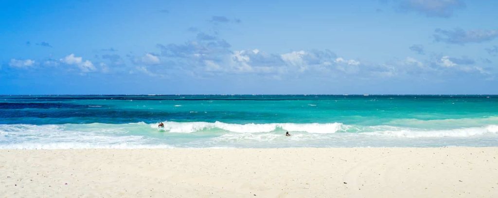 white sand beach during daytime