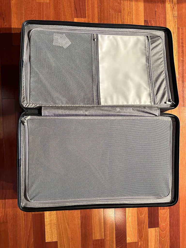 open suitcase with interior zippers