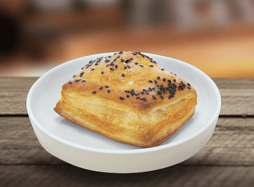 a savory pastry on a white plate